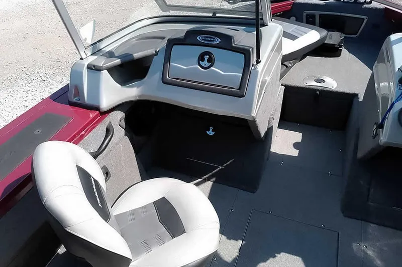 Slide: The Image of 2018 Tracker Targa V-18 Combo boat interior with seating and dashboard. - 26