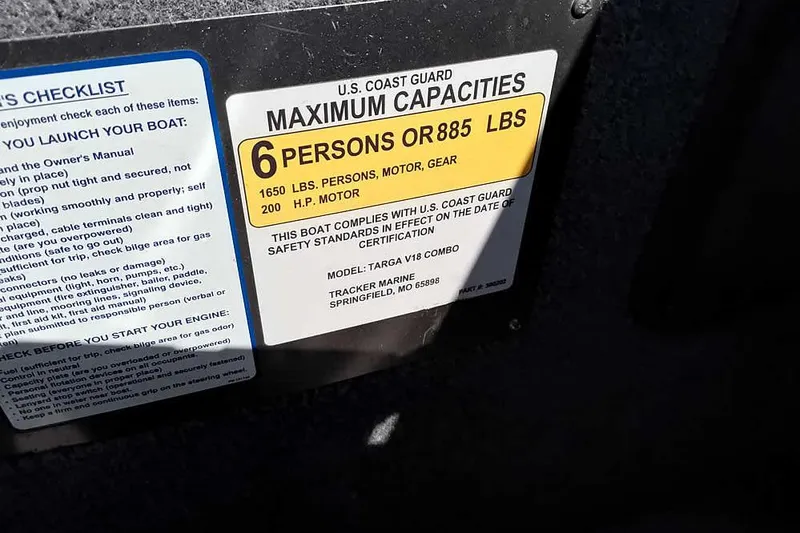 Slide: The Image of 2018 Tracker Targa V-18 Combo capacity label, 6 persons or 885 lbs, 200 HP motor. - 29