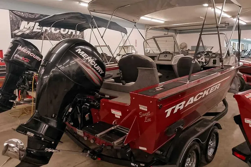 Slide: The Image of 2018 Tracker Targa V-18 Combo boat with Mercury engine in showroom. - 4