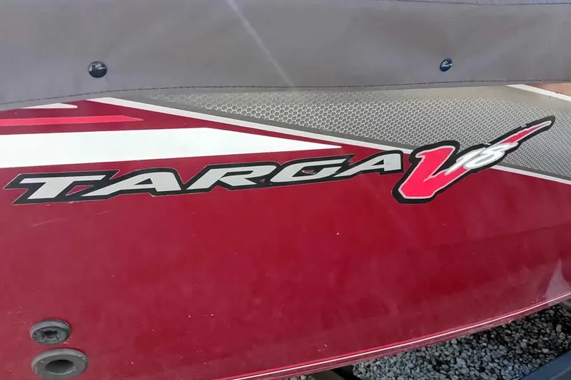 Slide: The Image of 2018 Tracker Targa V-18 Combo boat logo on red surface. - 6