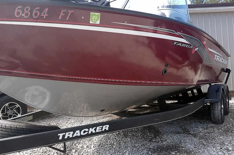 Slide: The Image of 2018 Tracker Targa V-18 Combo boat on trailer, red and white design. - 9