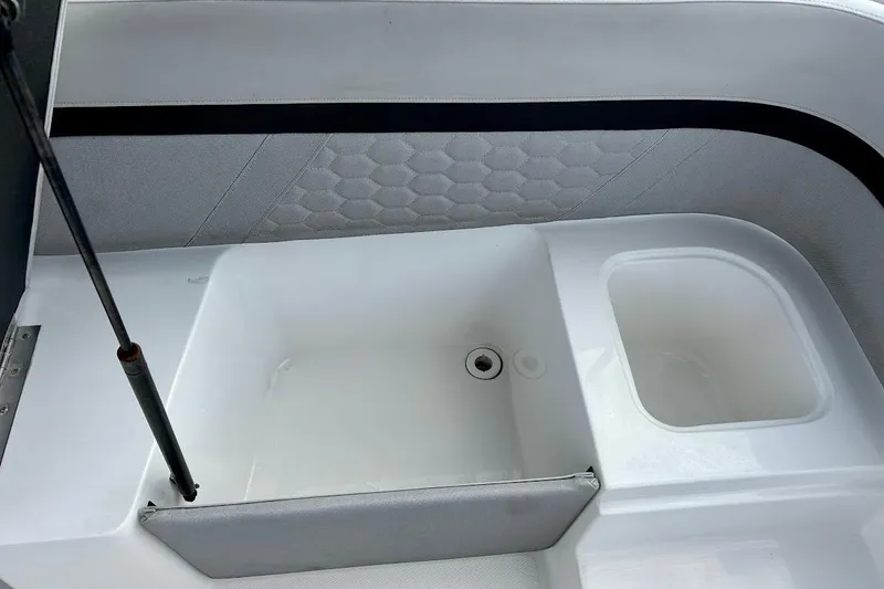 Slide: The Image of 2024 Hurricane Sundeck Sport 218 OB boat interior storage compartments. - 24
