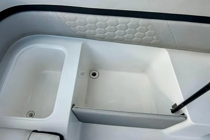 Slide: The Image of 2024 Hurricane Sundeck Sport 218 OB boat interior storage compartment. - 25