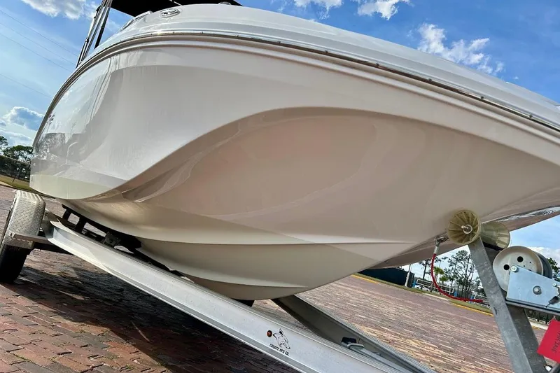 Slide: The Image of 2024 Hurricane Sundeck Sport 218 OB boat on trailer, viewed from below. - 7