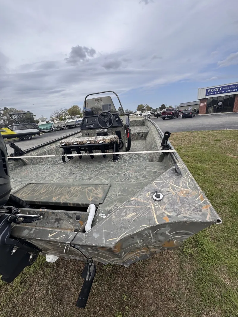 Slide: The Image of 2011 War Eagle 2072 Ducks Unlimited boat parked on grass. - 2