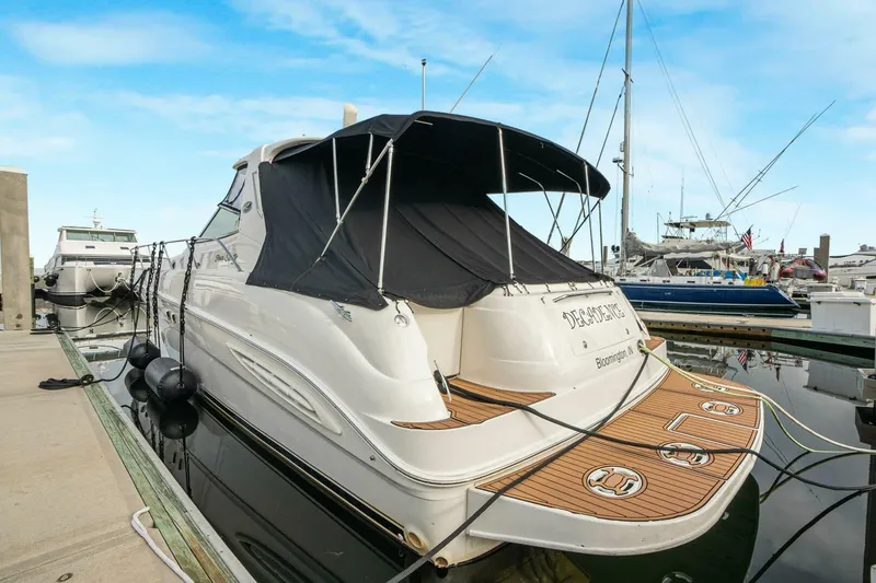 Slide: The Image of 2003 Sea Ray Sundancer 460 yacht docked at marina with covered deck. - 10