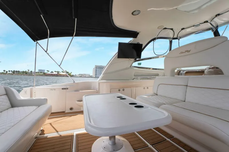 Slide: The Image of Luxurious 2003 Sea Ray Sundancer 460 yacht interior with elegant seating and scenic waterfront view. - 16