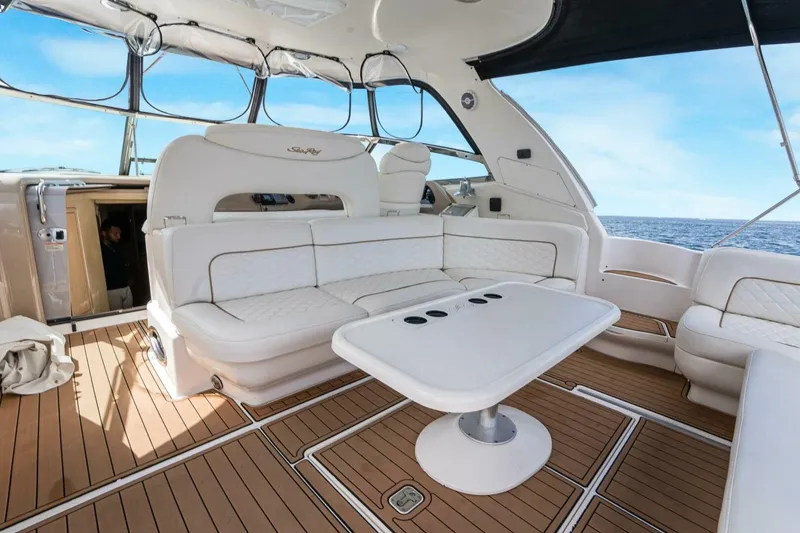 Slide: The Image of Luxurious 2003 Sea Ray Sundancer 460 yacht interior with white seating and ocean view. - 19