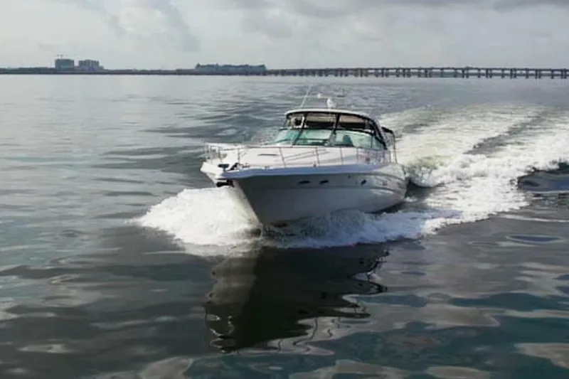 Slide: The Image of 2003 Sea Ray Sundancer 460 cruising on calm waters. - 2