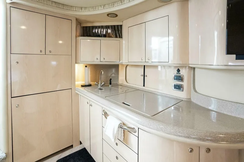 Slide: The Image of Luxurious kitchen interior of 2003 Sea Ray Sundancer 460 yacht with modern cabinetry. - 20