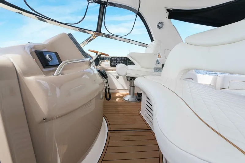 Slide: The Image of Luxurious interior of 2003 Sea Ray Sundancer 460 yacht with elegant seating and helm. - 21