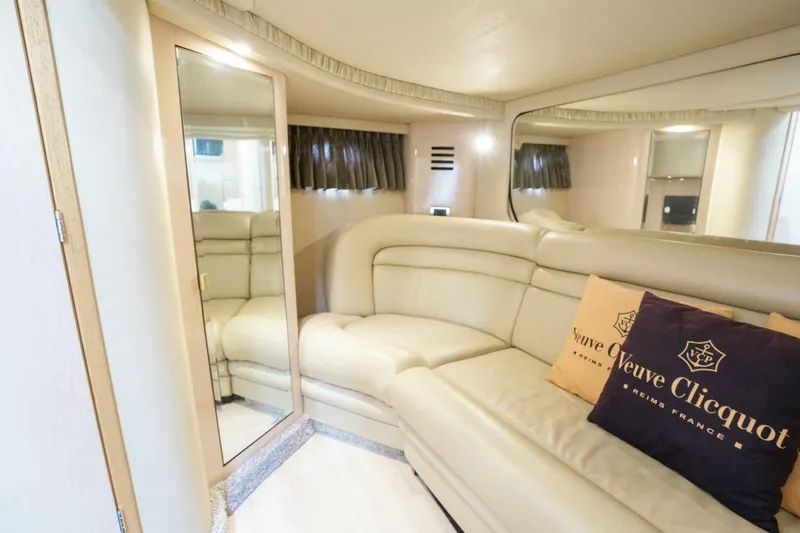 Slide: The Image of Luxurious interior of 2003 Sea Ray Sundancer 460 yacht with plush seating and elegant decor. - 24
