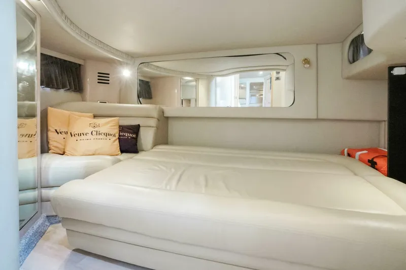 Slide: The Image of Luxurious interior cabin of 2003 Sea Ray Sundancer 460 yacht with plush bedding. - 26