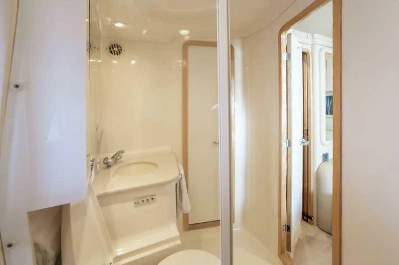 Slide: The Image of Bathroom interior of 2003 Sea Ray Sundancer 460 yacht, featuring sleek design and modern fixtures. - 27