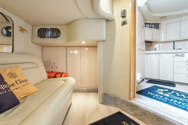 Slide: The Image of Luxurious interior of 2003 Sea Ray Sundancer 460 yacht with modern kitchen and cozy seating area. - 30