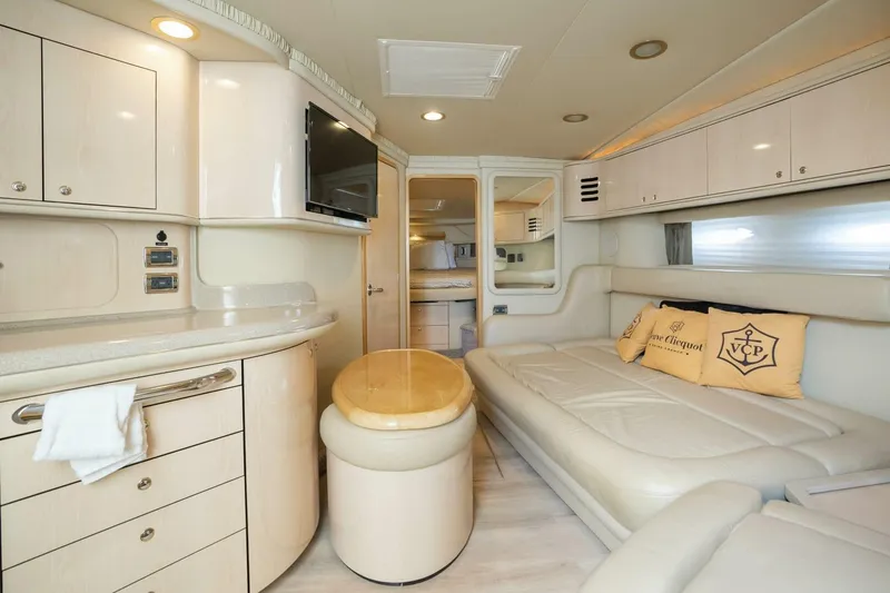 Slide: The Image of Luxurious interior of 2003 Sea Ray Sundancer 460 yacht with elegant seating and cabinetry. - 31