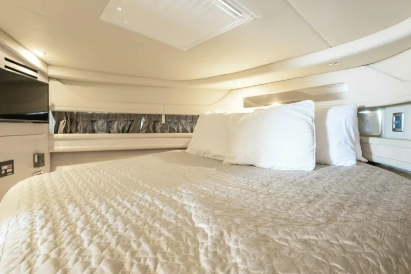 Slide: The Image of Luxurious cabin interior of 2003 Sea Ray Sundancer 460 yacht with cozy bedding. - 36