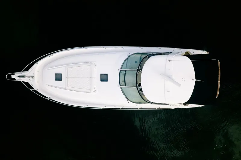 Slide: The Image of Aerial view of 2003 Sea Ray Sundancer 460 yacht on dark water. - 8