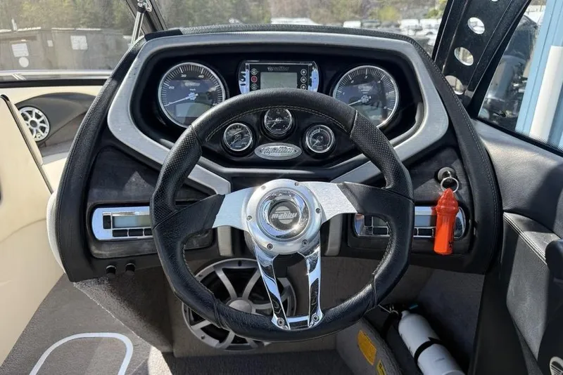 Slide: The Image of Steering wheel and dashboard of 2008 Malibu Sunscape 23 LSV boat. - 12