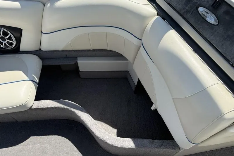 Slide: The Image of Interior seating of a 2008 Malibu Sunscape 23 LSV boat with white upholstery. - 18