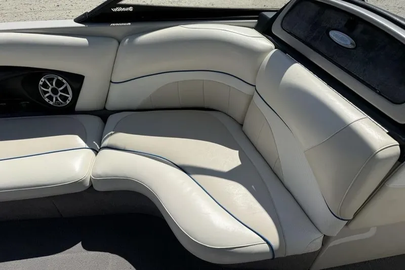 Slide: The Image of Interior seating of a 2008 Malibu Sunscape 23 LSV boat with white upholstery. - 19