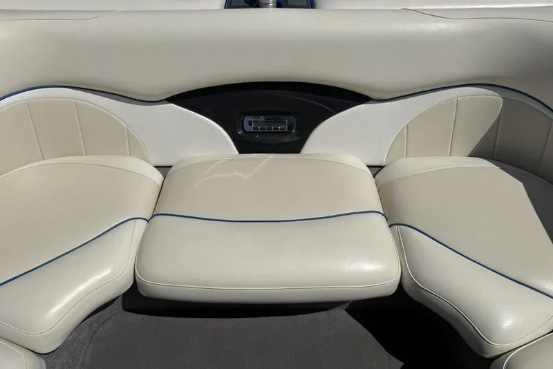 Slide: The Image of 2008 Malibu Sunscape 23 LSV boat interior with beige cushioned seating. - 26