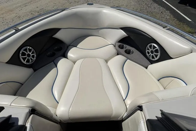 Slide: The Image of 2008 Malibu Sunscape 23 LSV boat interior with white leather seating and speakers. - 3