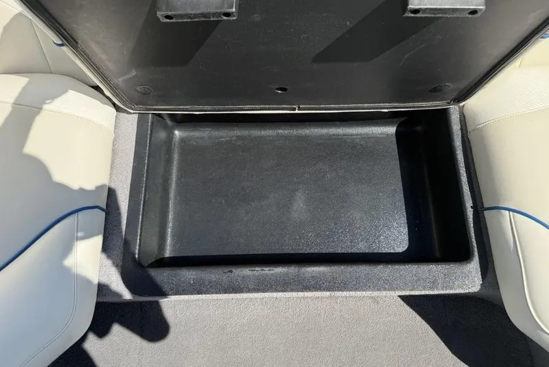 Slide: The Image of Open storage compartment in a 2008 Malibu Sunscape 23 LSV boat interior. - 31