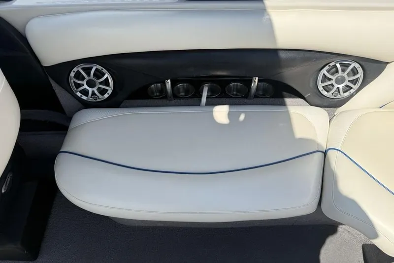 Slide: The Image of Interior of a 2008 Malibu Sunscape 23 LSV boat with speakers and seating. - 32
