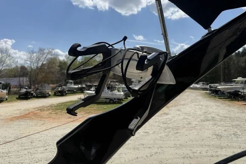 Slide: The Image of Wakeboard rack on 2008 Malibu Sunscape 23 LSV boat under sunny sky. - 36