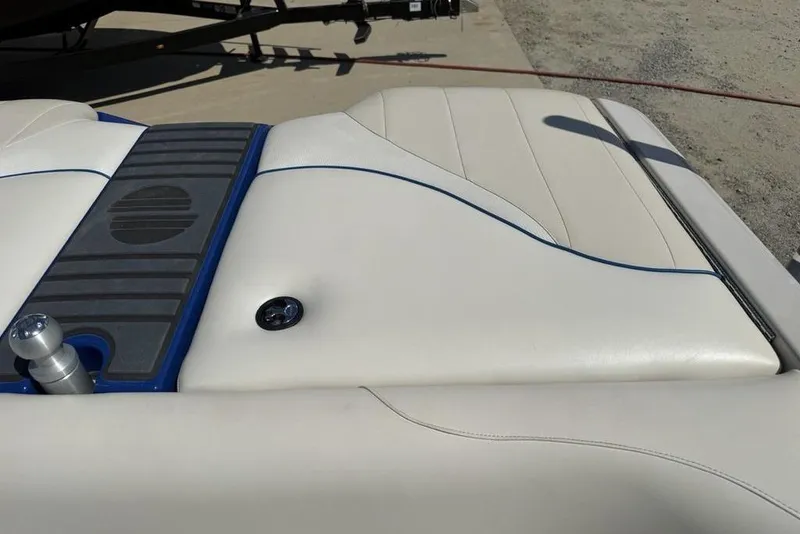 Slide: The Image of 2008 Malibu Sunscape 23 LSV boat interior with white upholstery and blue accents. - 37