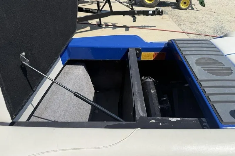Slide: The Image of Open storage compartment of a 2008 Malibu Sunscape 23 LSV boat. - 39