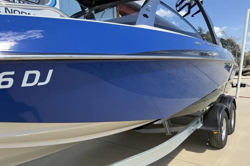 Slide: The Image of 2008 Malibu Sunscape 23 LSV boat on trailer, blue exterior, side view. - 5