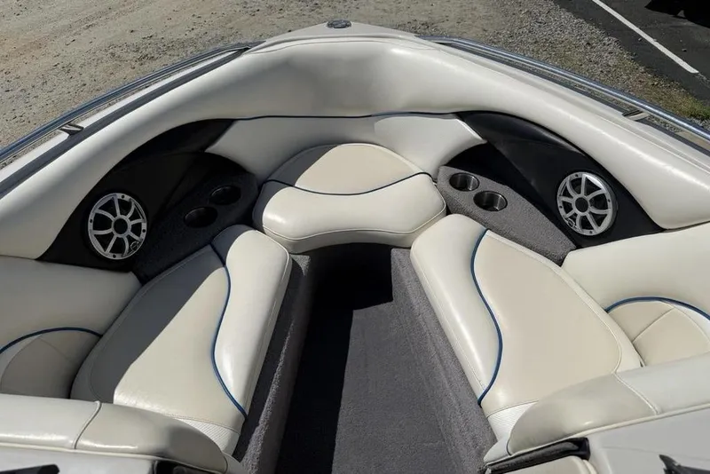 Slide: The Image of Luxurious interior of a 2008 Malibu Sunscape 23 LSV boat with plush seating and speakers. - 8