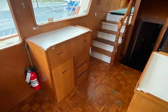 Slide: The Image of Interior of 1980 Ocean Alexander 50 Mark I yacht with wooden cabinetry and stairs. - 15