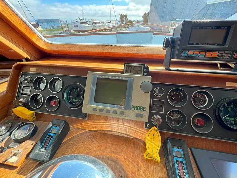 Slide: The Image of Control panel of a 1980 Ocean Alexander 50 MK1 yacht with gauges and navigation equipment. - 21