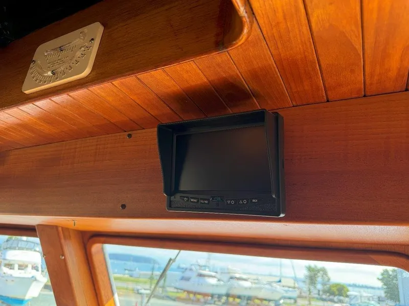 Slide: The Image of Interior of 1980 Ocean Alexander 50 MK1 with wooden paneling and a mounted screen. - 24