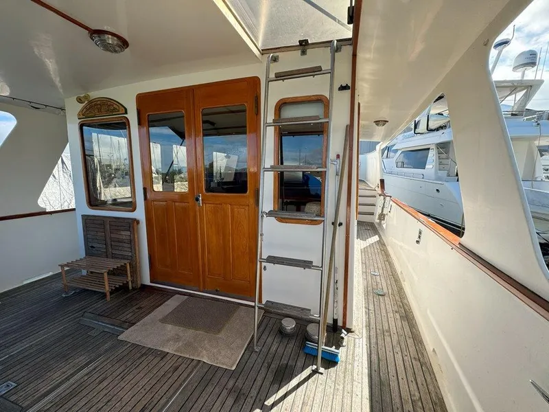 Slide: The Image of Ocean Alexander 50 MK1 1980 yacht deck with wooden doors and ladder. - 3