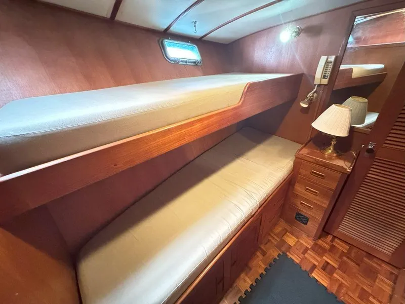 Slide: The Image of Interior cabin of 1980 Ocean Alexander 50 MK1 with wooden bunk beds and storage. - 32