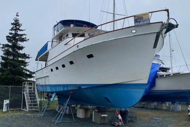 Slide: The Image of 1980 Ocean Alexander 50 Mark I yacht on dry dock, blue hull, ready for maintenance. - 47