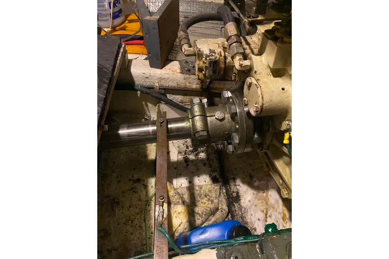 Slide: The Image of Engine room of 1980 Ocean Alexander 50 Mark I yacht, showing mechanical components. - 58