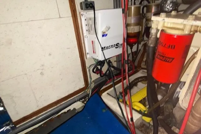 Slide: The Image of Engine room of 1980 Ocean Alexander 50 Mark I with electrical and fuel components. - 73