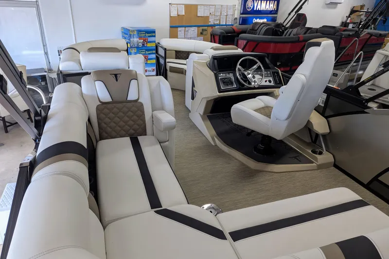 Slide: The Image of Luxurious interior of 2026 Trifecta 21C SS boat with plush seating and modern dashboard. - 11