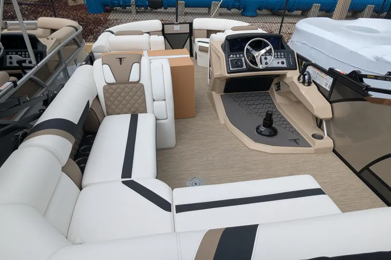Slide: The Image of 2026 Trifecta 21C SS pontoon boat interior with luxurious seating and modern dashboard. - 2
