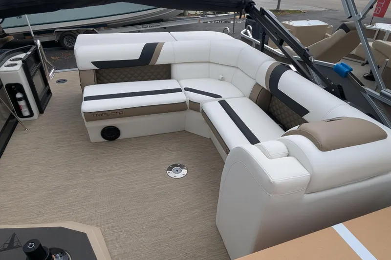 Slide: The Image of Luxurious seating on 2026 Trifecta 21C SS boat with modern design and beige upholstery. - 4