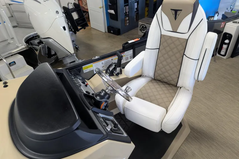 Slide: The Image of Luxurious captain's chair in 2026 Trifecta 21C SS boat, featuring elegant diamond stitching. - 7