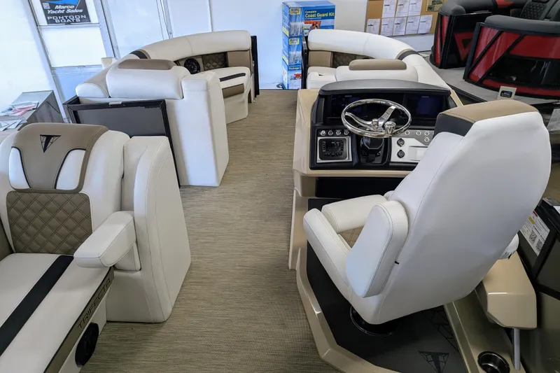 Slide: The Image of Luxurious interior of 2026 Trifecta 21C SS pontoon boat with plush seating and modern helm. - 8