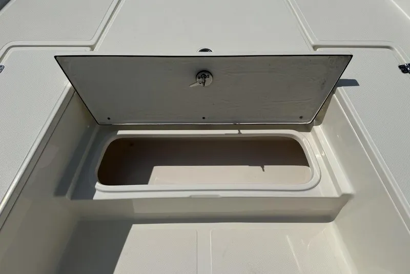 Slide: The Image of Open storage compartment on a 2023 Bulls Bay 2400 boat deck. - 10