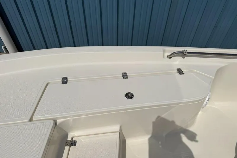 Slide: The Image of 2023 Bulls Bay 2400 boat deck with storage compartment and stainless steel railing. - 13