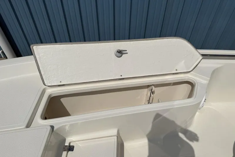 Slide: The Image of 2023 Bulls Bay 2400 boat storage compartment with open hatch, showcasing interior space. - 16